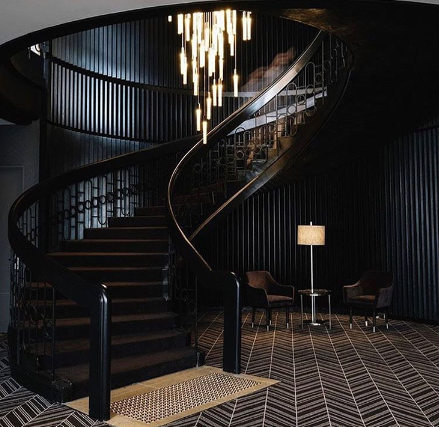 Royal Thai patterned carpet in an elegant interior with a curved staircase